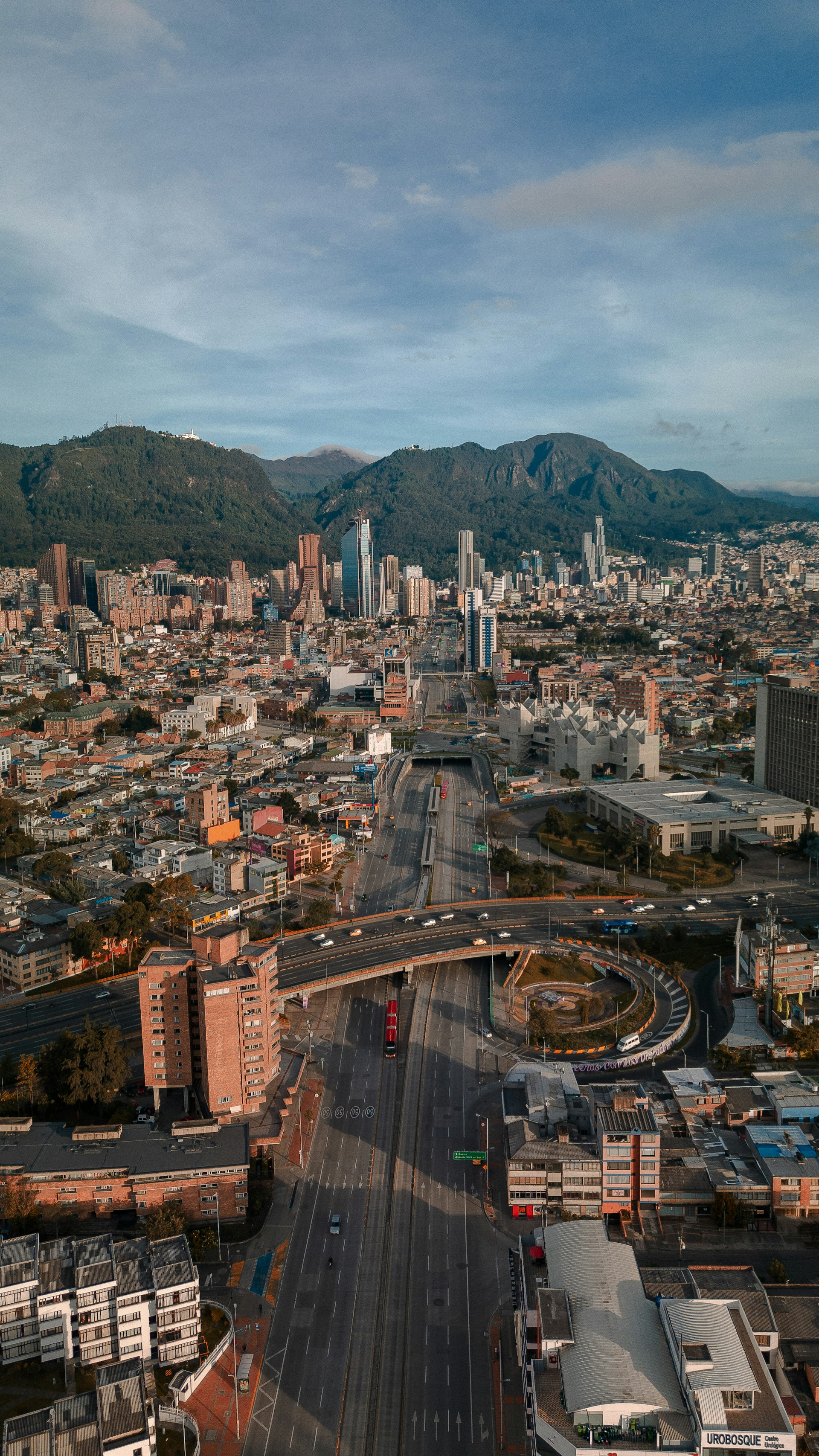 Aerial view of downtown Bogotá skyline with the Andes mountains and Monserrate in the background