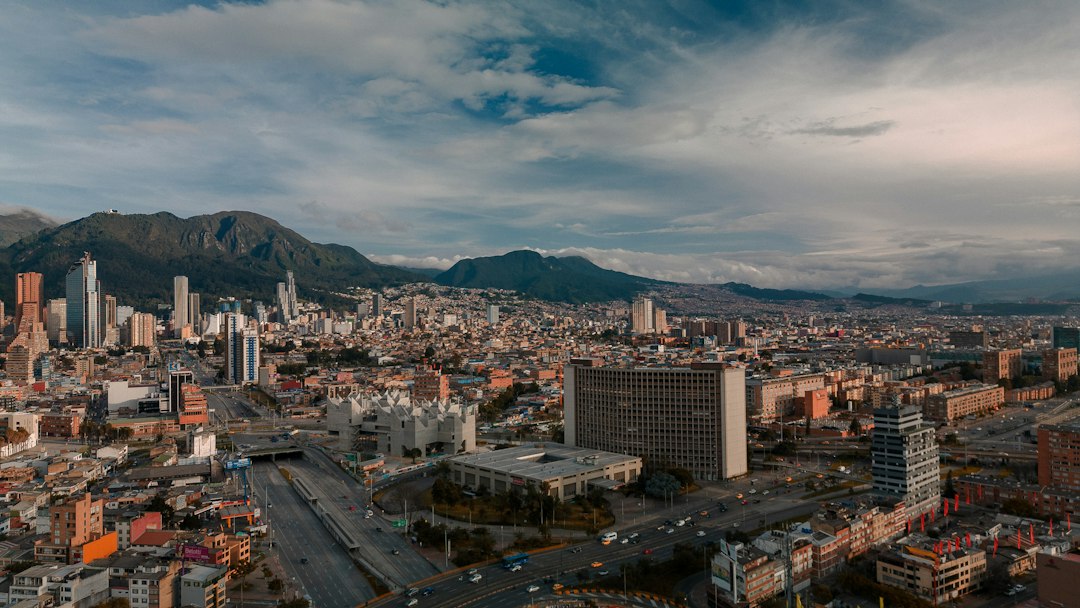 an aerial view of a city with mountains in the background, City from the top.