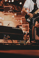 a man playing a guitar on a stage
