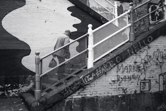 Illustration of a person climbing stairs symbolizing progress and growth.