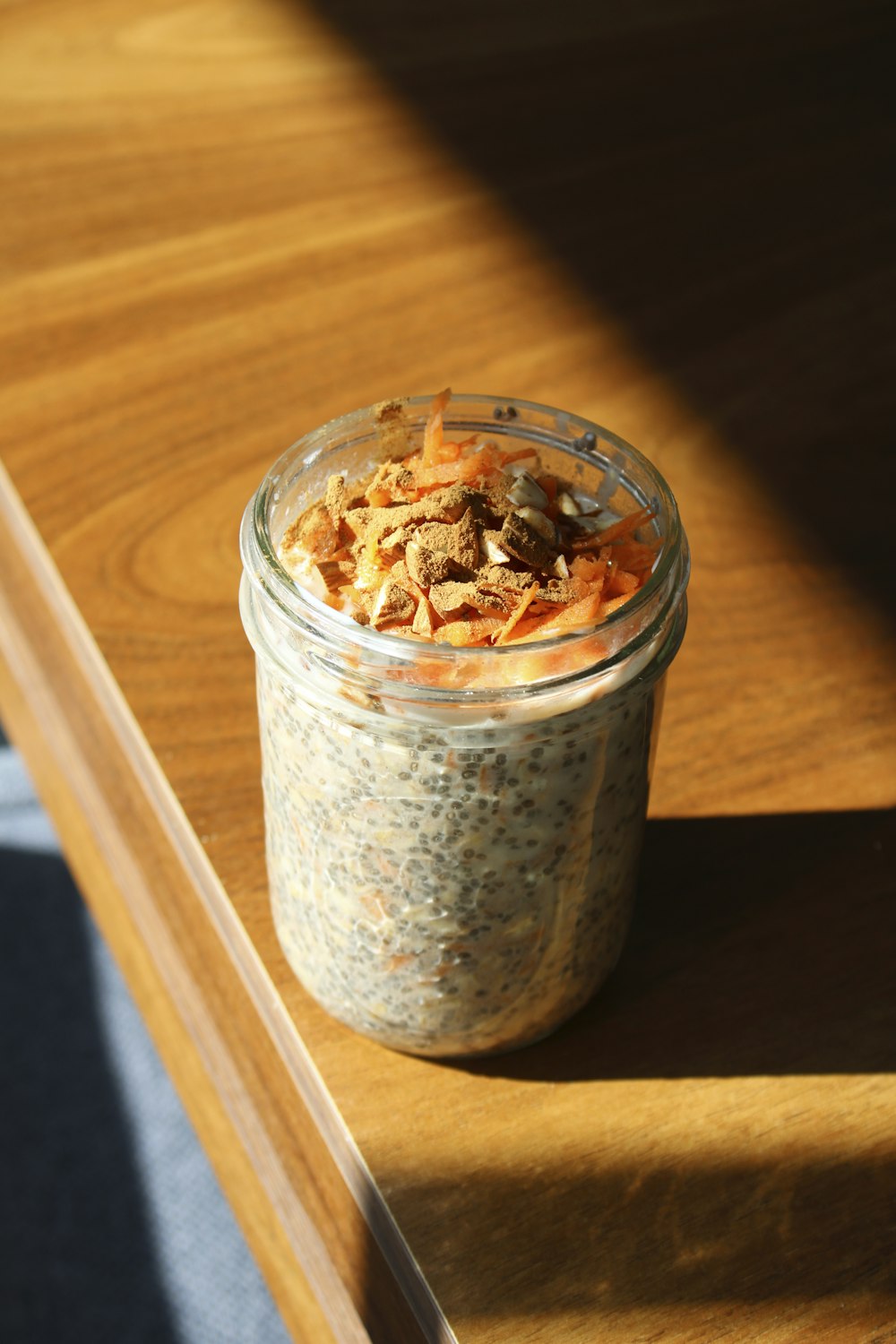 a jar of food sitting on top of a wooden table