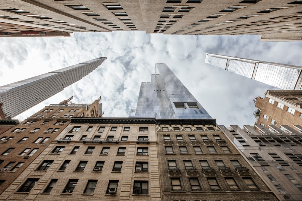 looking up at tall buildings in a city