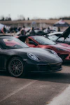 a group of cars parked next to each other in a parking lot