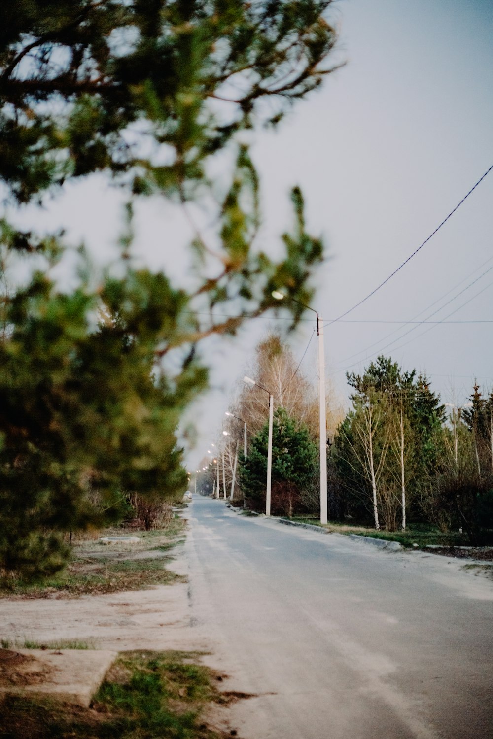 an empty street with a stop sign on the side of it