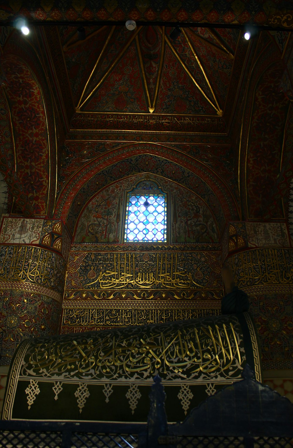 a very ornate room with a stained glass window