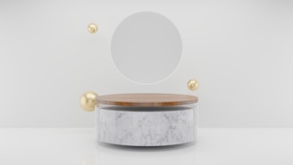 a round mirror sitting on top of a white table