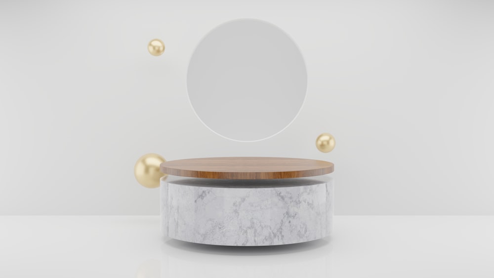 하얀 테이블 위에 앉아 있는 둥근 거울