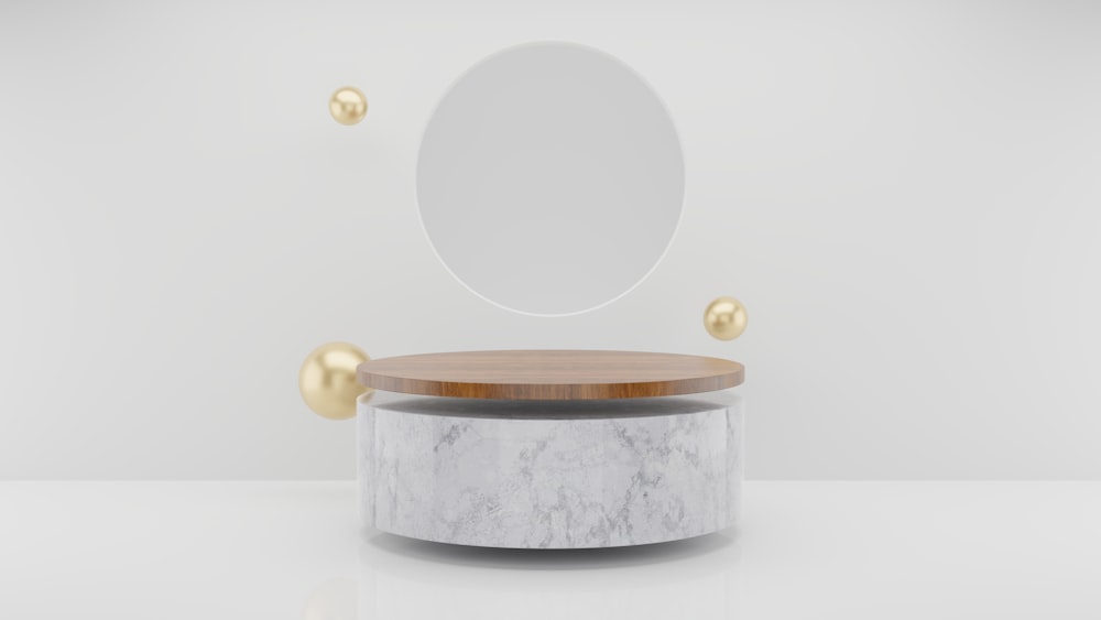 a round mirror sitting on top of a white table