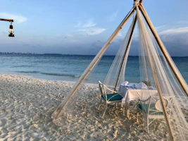 A cozy beachside setting with artisanal home decor and elegant tableware inspired by Bahia.