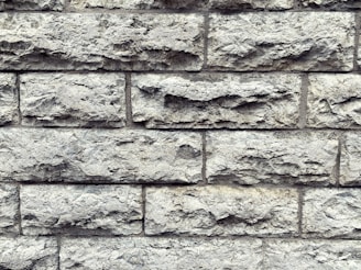 Close-up of rustic natural stone tiles arranged for an outdoor wall.