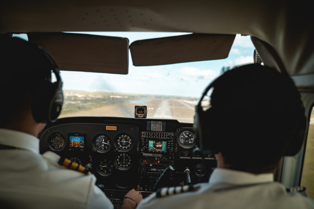 two pilots in the cockpit of an airplane