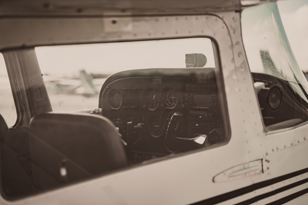 the cockpit of a small airplane with a pilot in it,