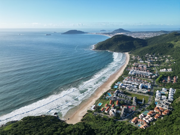a bird's eye view of a beach and ocean