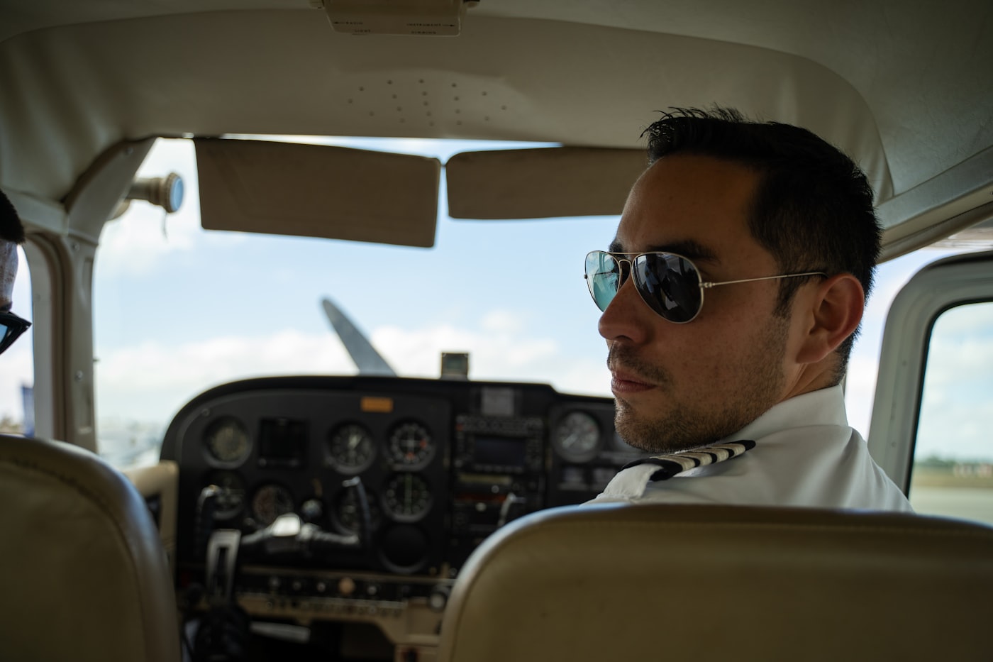 Aviation ramp agent guiding aircraft with signal wands