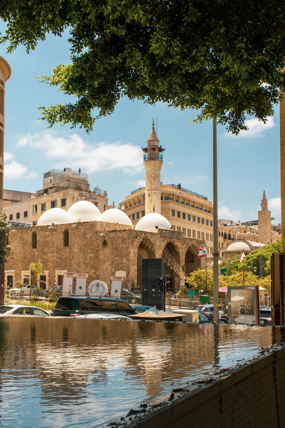 a large building sitting next to a body of water