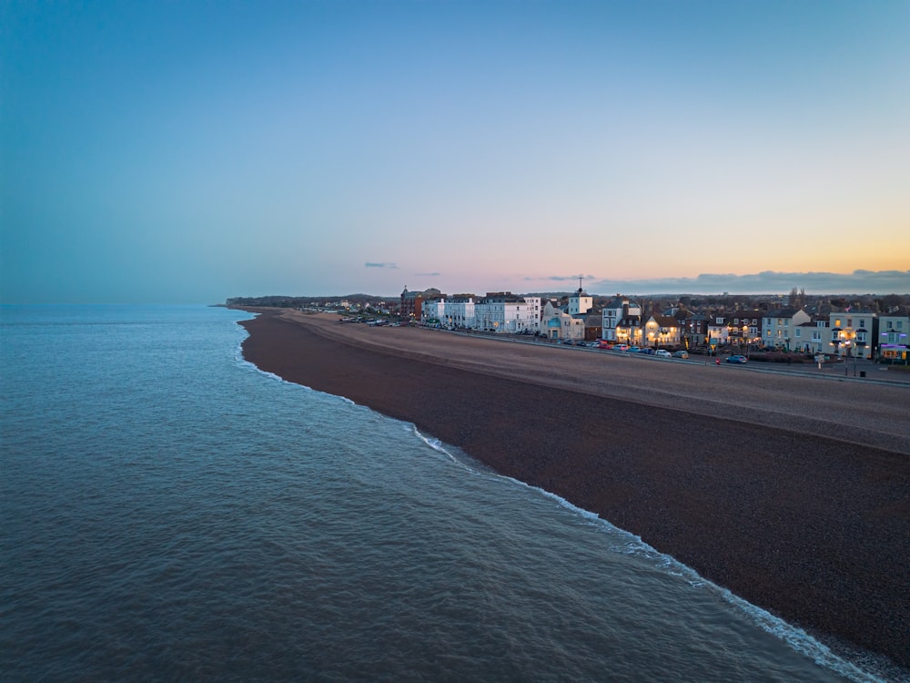 a view of a beach with a city in the distance