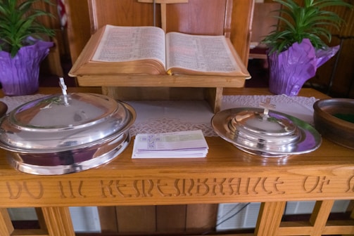 Printed educational materials and pamphlets about addiction recovery on a wooden table.