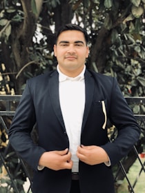 A professional lawyer standing confidently in front of a courthouse, ready for a case.