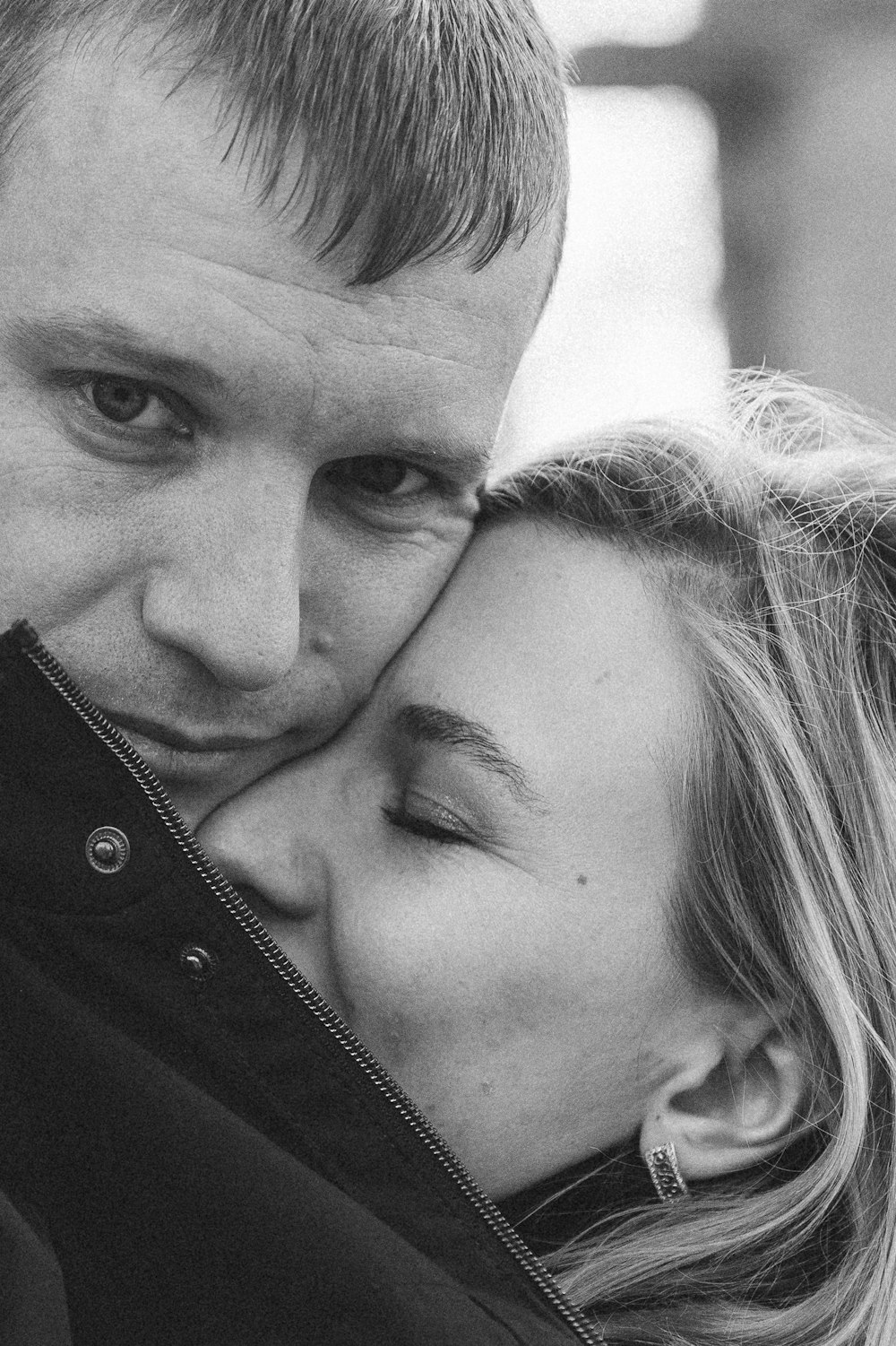 a black and white photo of a man and a woman