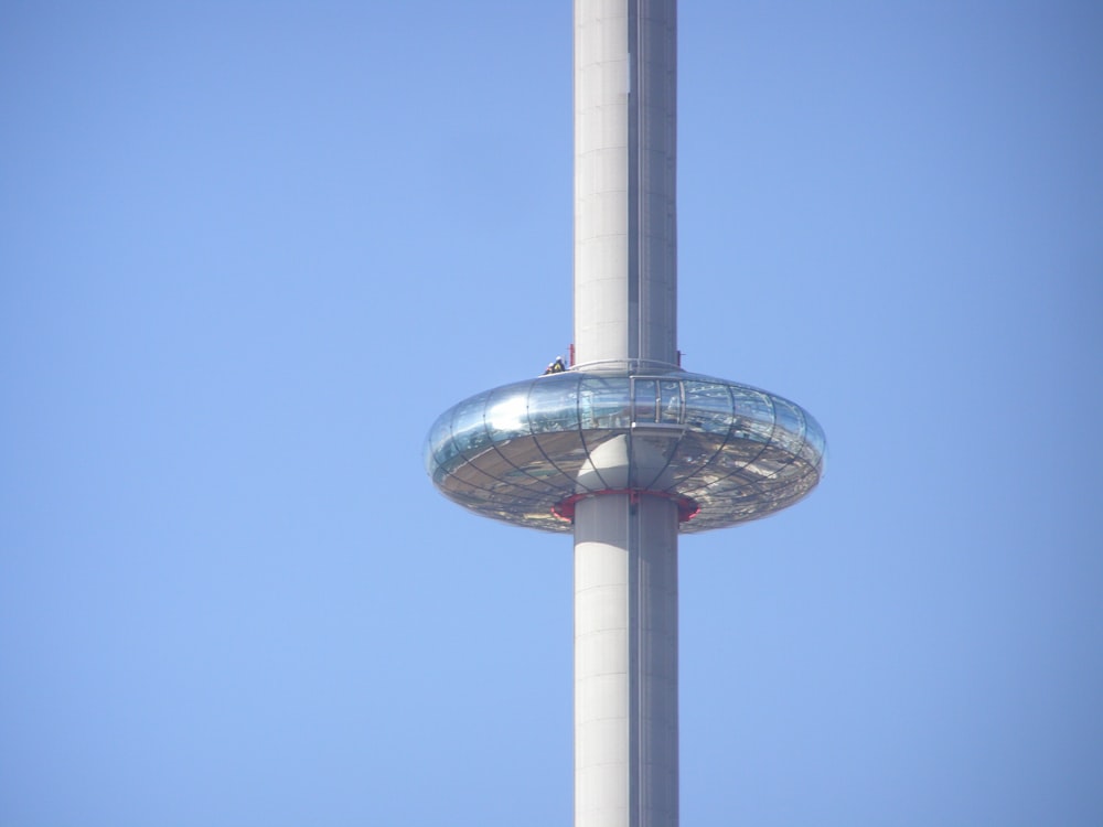 a tall pole with a metal object on top of it