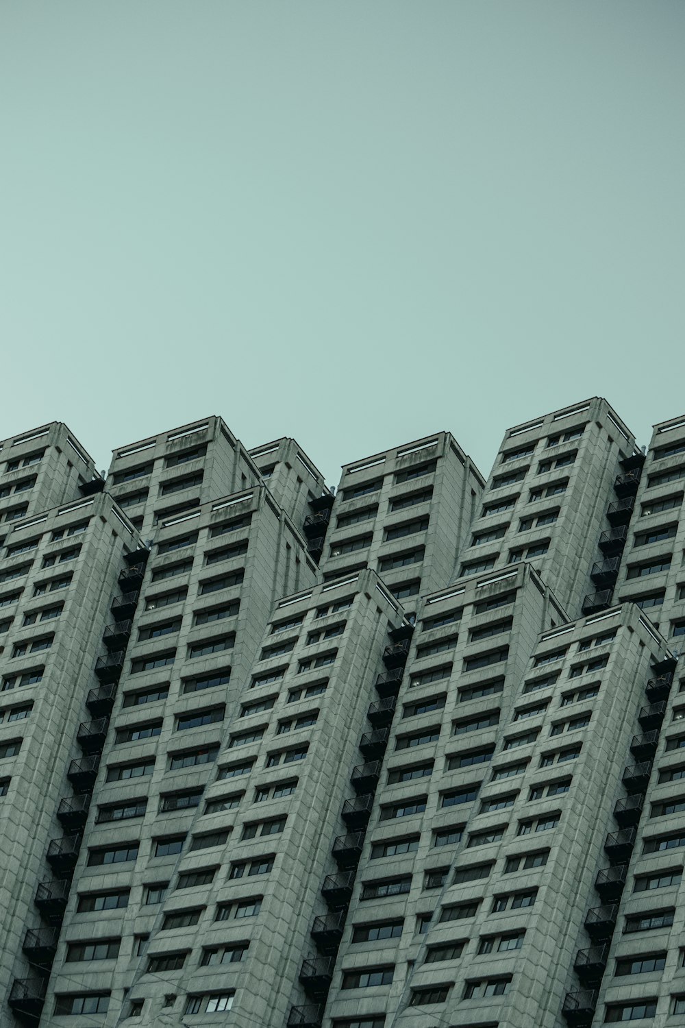 a very tall building with a clock on it's side