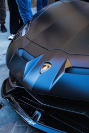 A sleek black hoodie emblazoned with a subtle revving tachometer design.