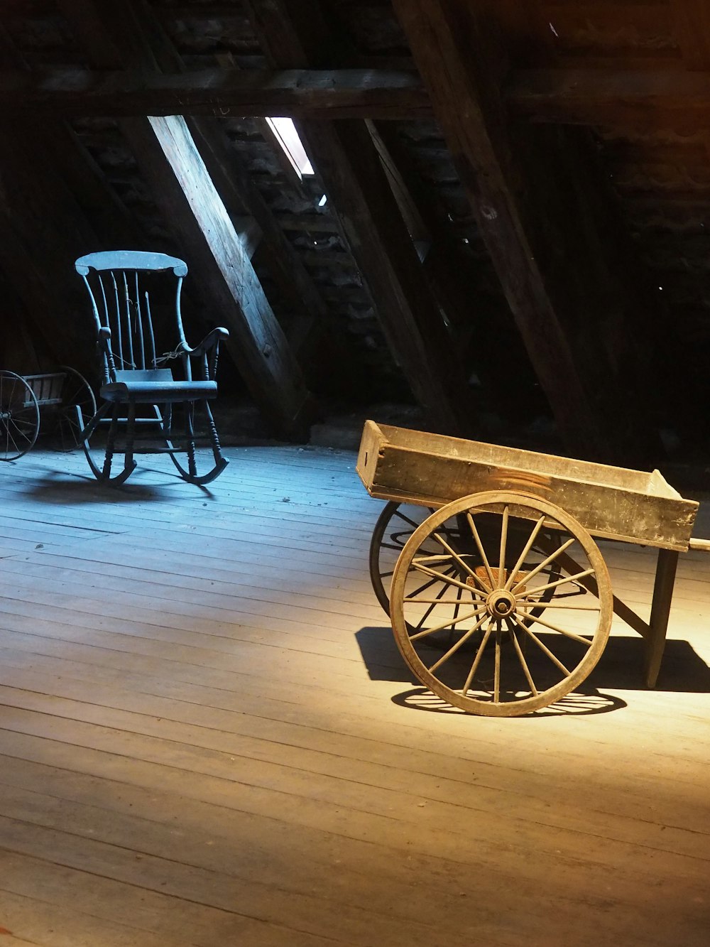 a wooden bench sitting on top of a wooden floor