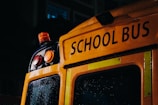Close-up of a school bus stop sign on a sunny day.