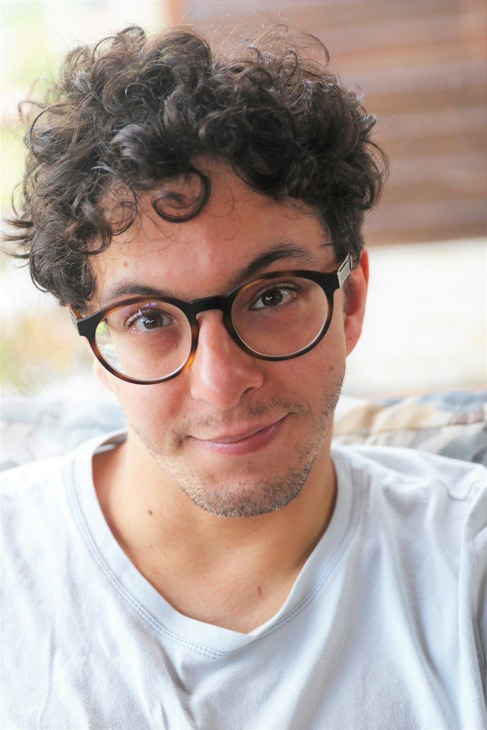 a close up of a person wearing glasses