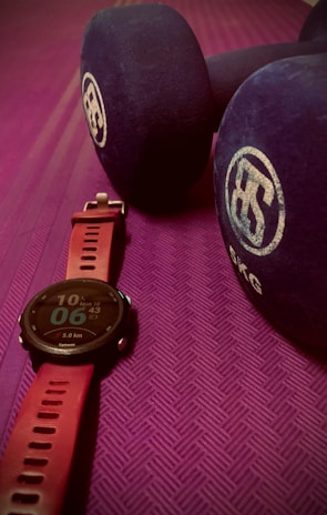 Close-up of high-quality fitness products including smartwatches and nutrition supplements.