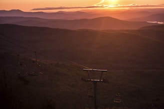 A scenic sunset view from a chalet balcony.