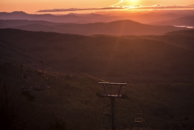 A scenic sunset view from a chalet balcony.