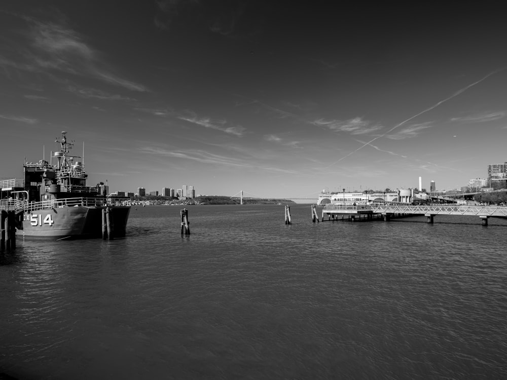 a black and white photo of a boat in the water