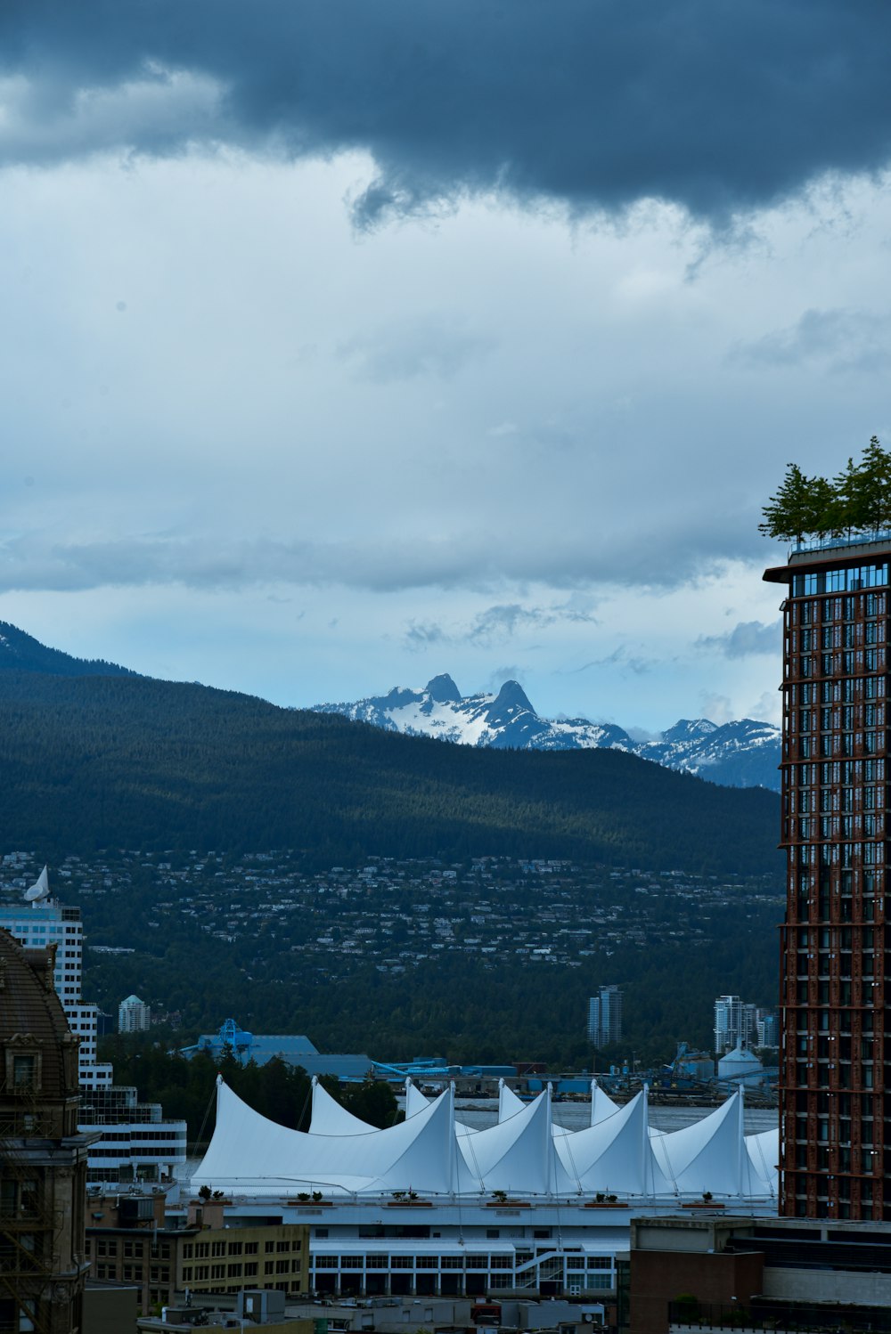 a view of a city with mountains in the background