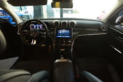 the interior of a car with a dash board and steering wheel
