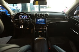 the interior of a car with a dash board and steering wheel