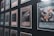 Several collectible cards are displayed in a grid-like pattern within a frame. One prominent card in the foreground features a dragon motif and is labeled 'Curse of Dragon.' The cards are in protective sleeves, and the display appears to be a part of a larger collection.