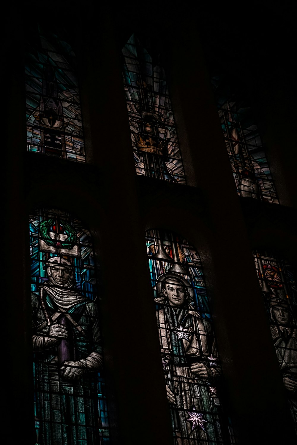 a stained glass window in a dark room