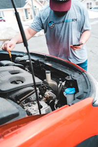 a man is working on a car engine