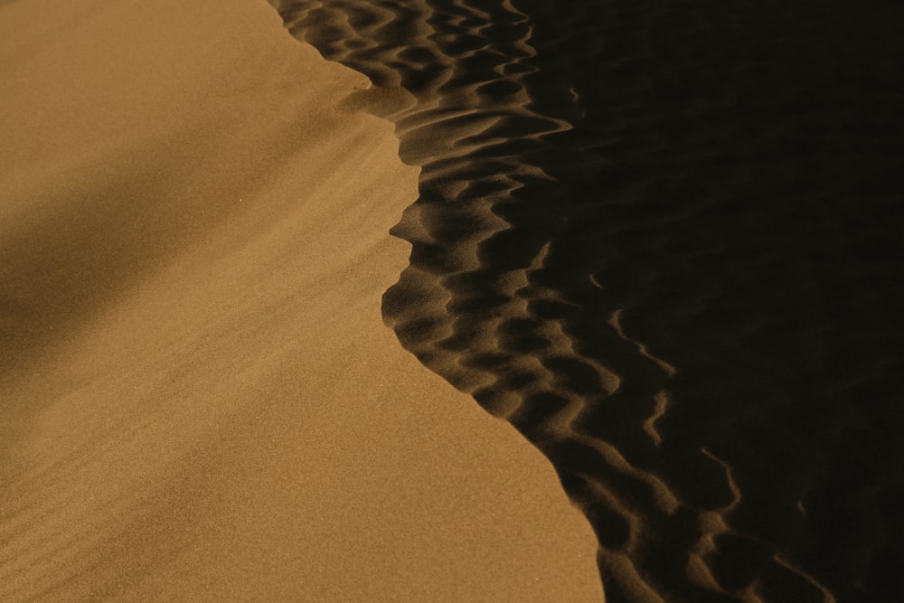 a sand dune in the middle of the desert