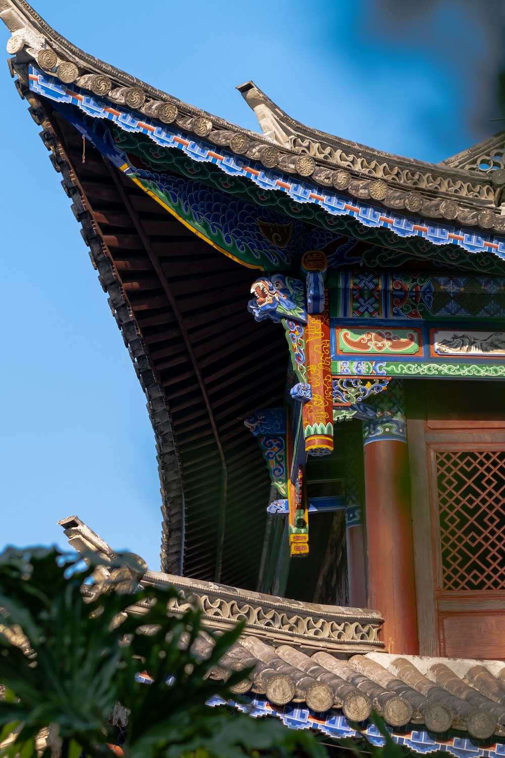 a bird is perched on the roof of a building