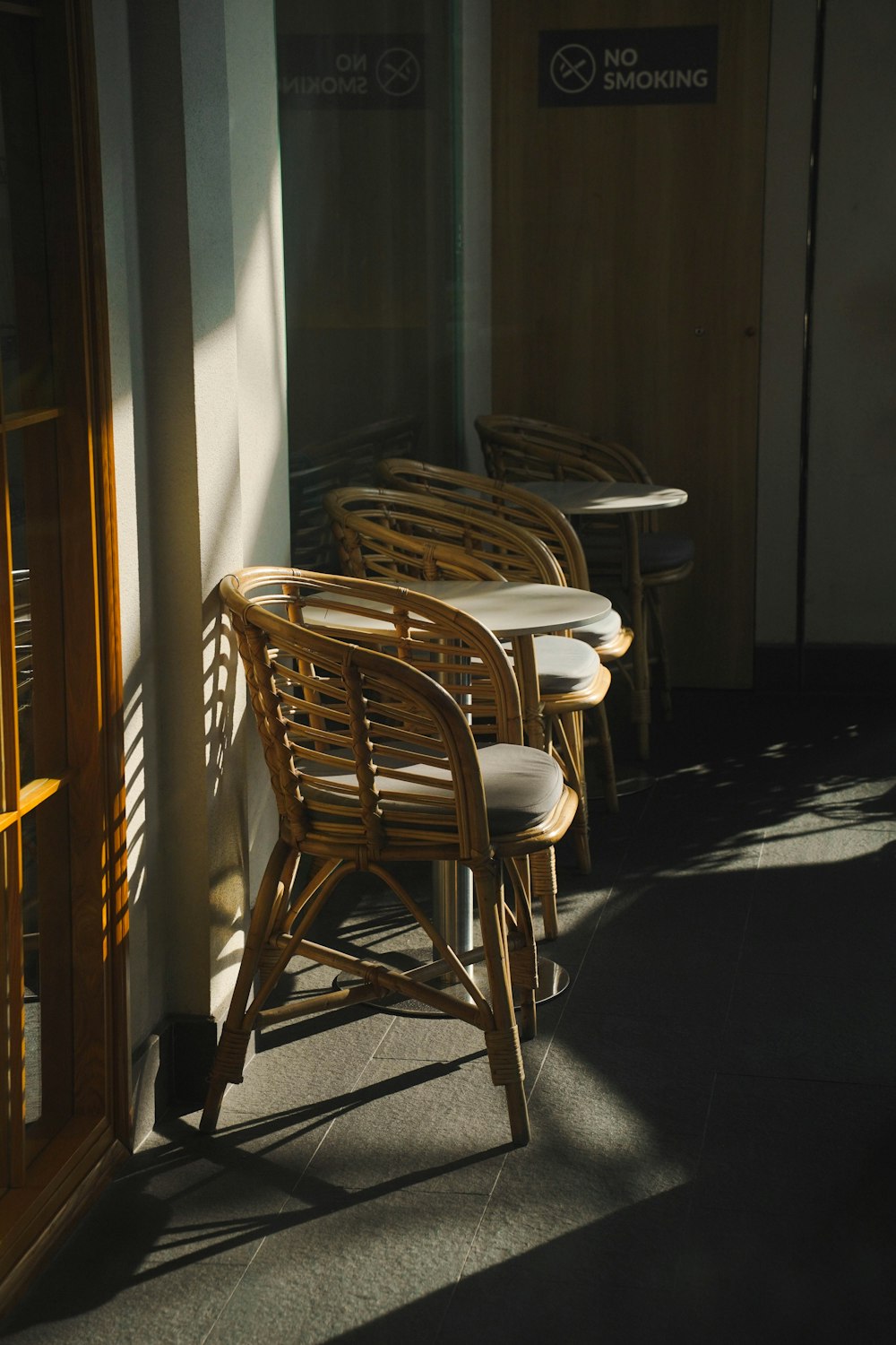 a row of wooden chairs sitting next to each other