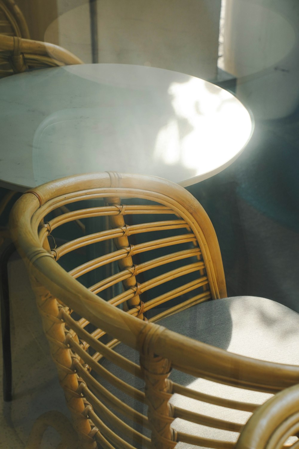 a table and chairs with a glass top