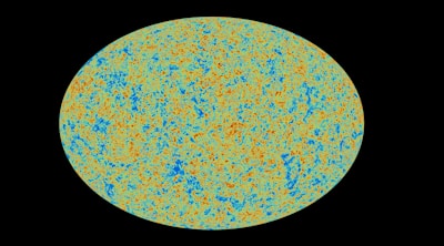 Colorful planetary symbols arranged neatly on a vibrant cloth.