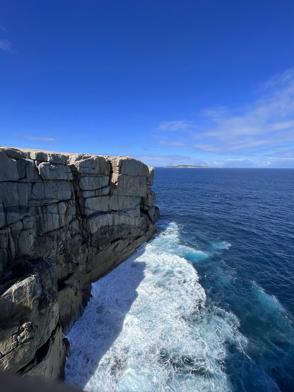 a view of the ocean from a cliff