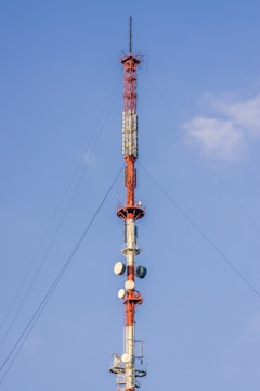 a very tall tower with a lot of antennas on top of it