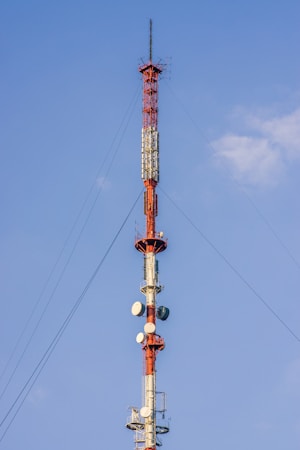 a very tall tower with a lot of antennas on top of it