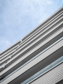 A high-resolution image of a beautifully designed modern building, showcasing architectural details against a clear sky.