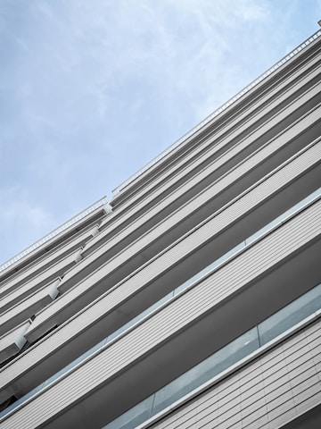 A high-resolution image of a beautifully designed modern building, showcasing architectural details against a clear sky.