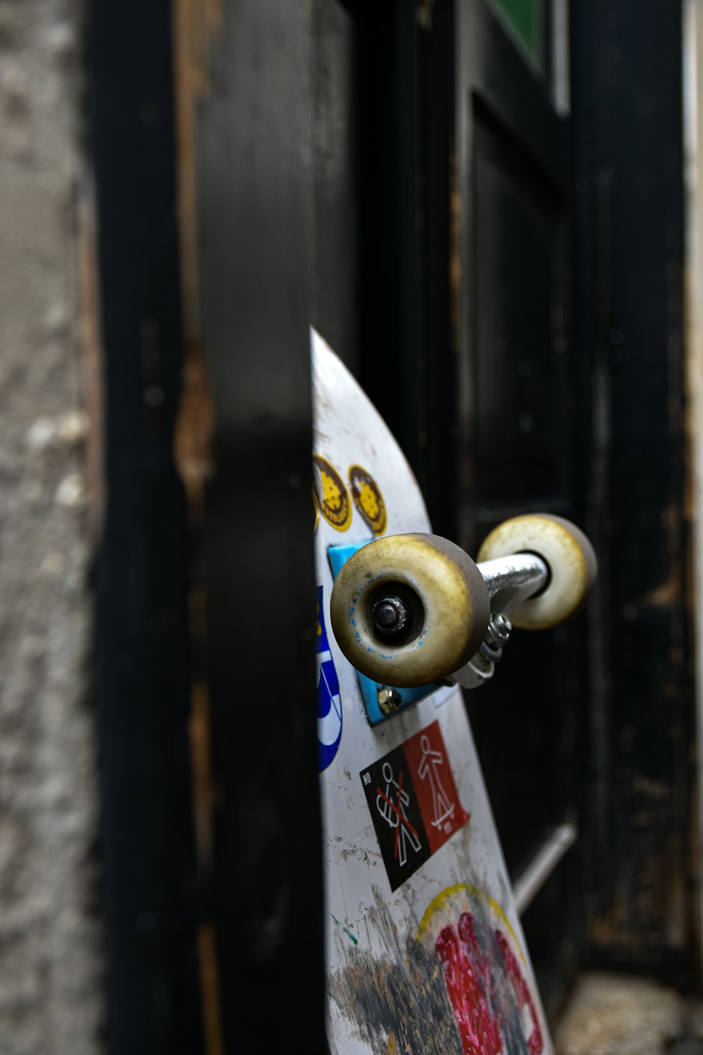 a close up of a skateboard with graffiti on it